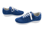 Pair of blue sneakers with white laces on a white background